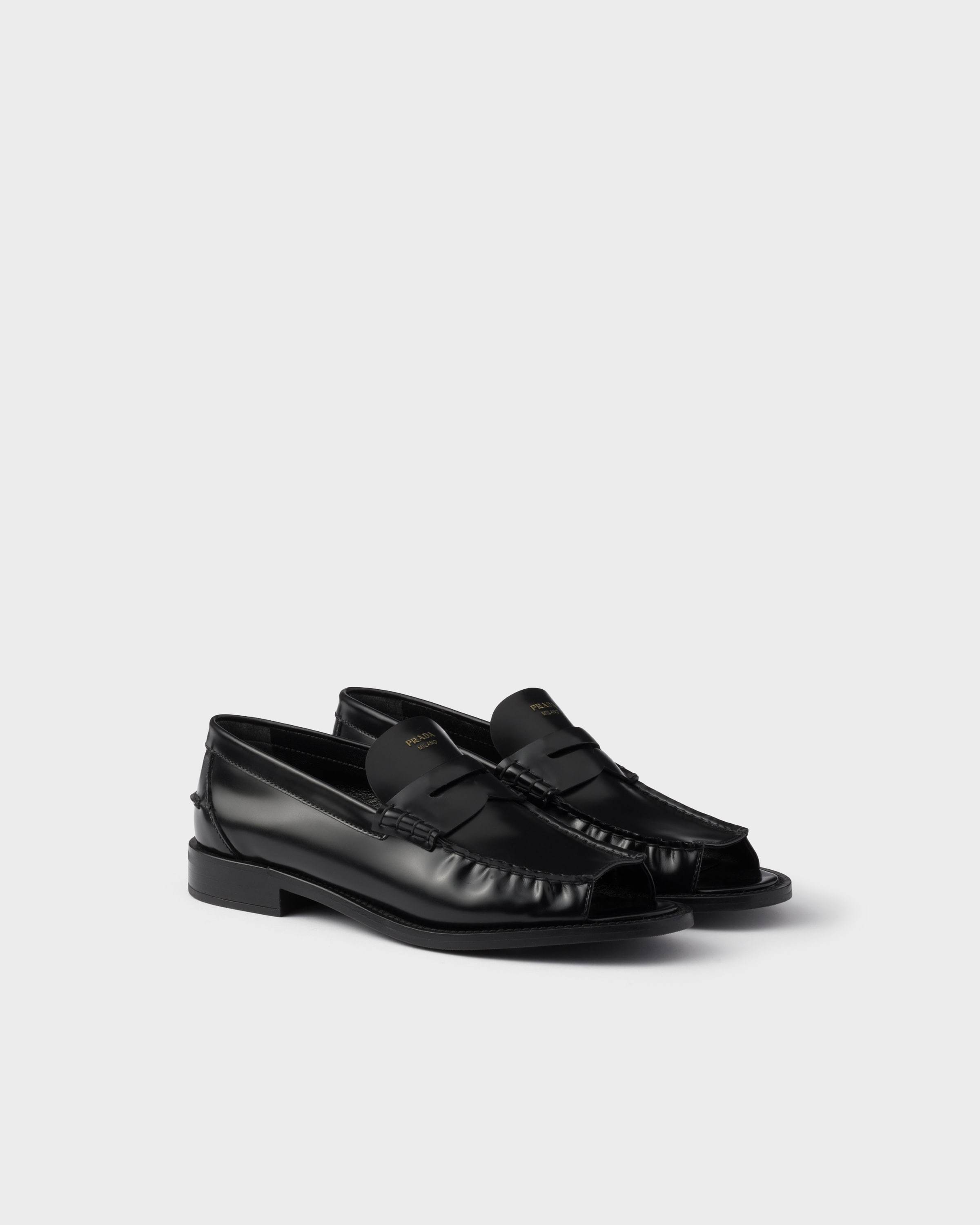 Prada Logo-printed Penny Loafers In Black