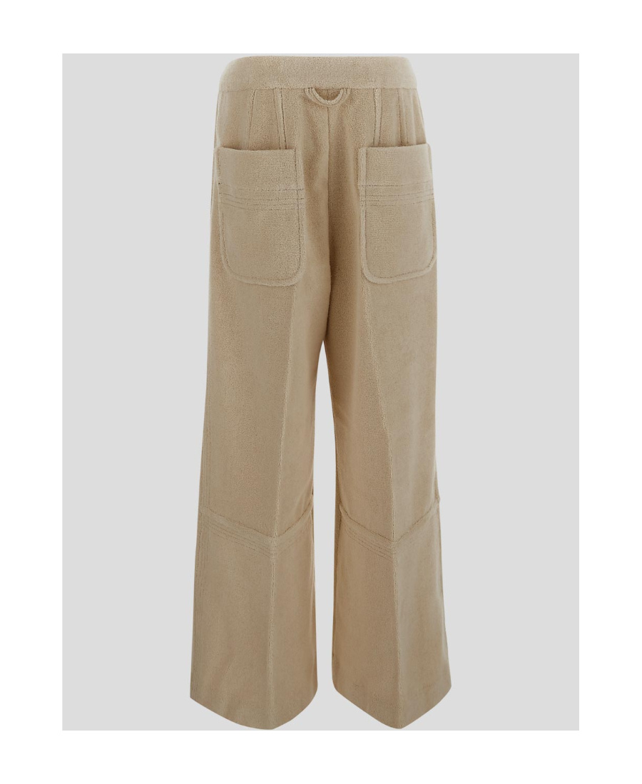 Shop Jacquemus Wide-leg Flared Trousers In Nude