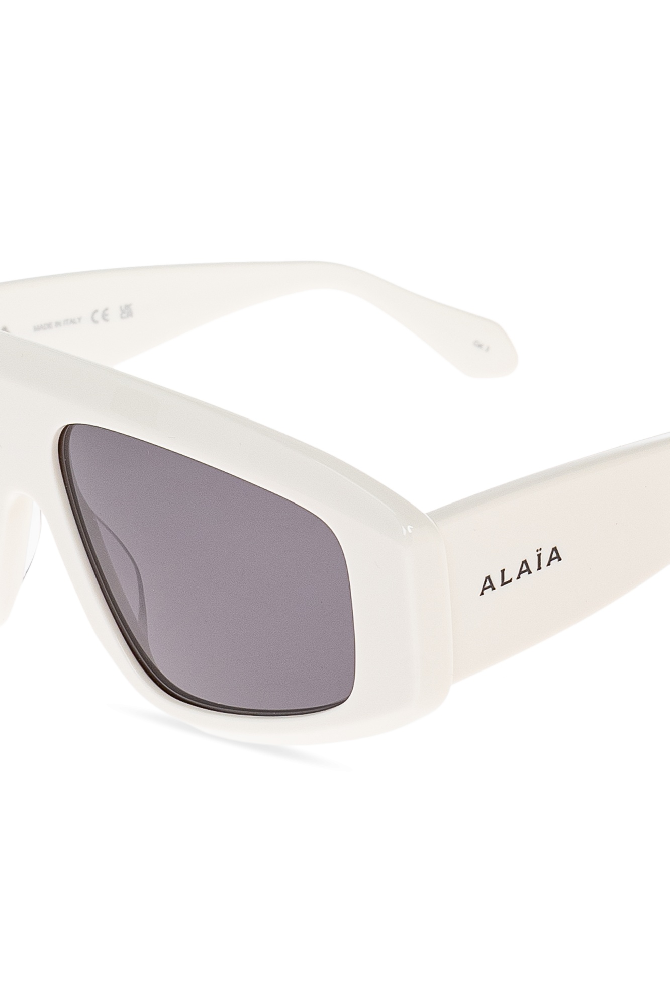 Alaïa Logo Sunglasses In Gray