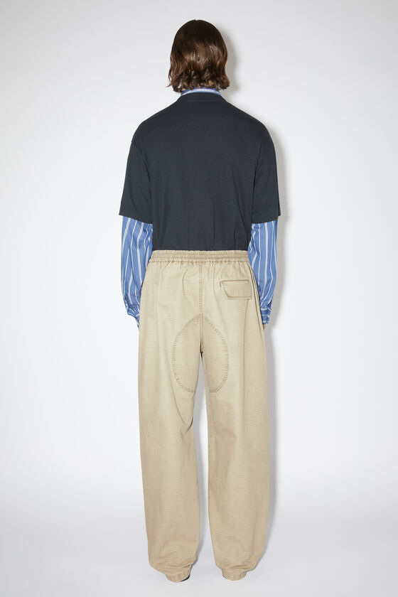 Acne Studios Logo Embroidered Mid-waist Pants In Nude