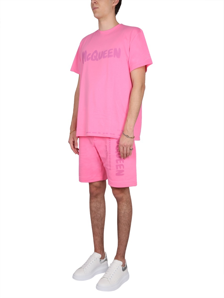 Alexander Mcqueen Men Bermuda Shorts With Graffiti Logo Print In Pink