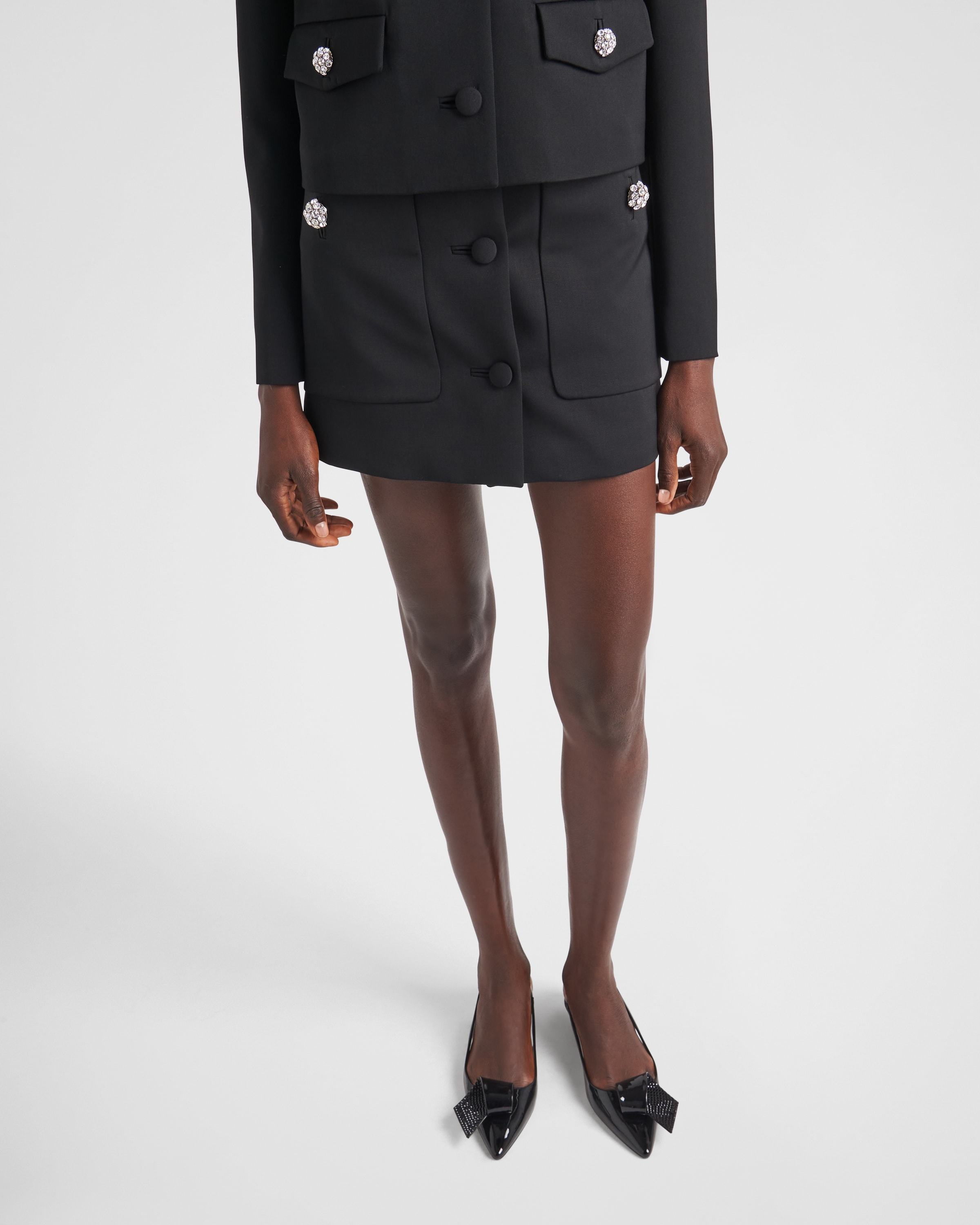 Prada Wool Mini Skirt With Oversized Pockets And Embellished Accents In Black