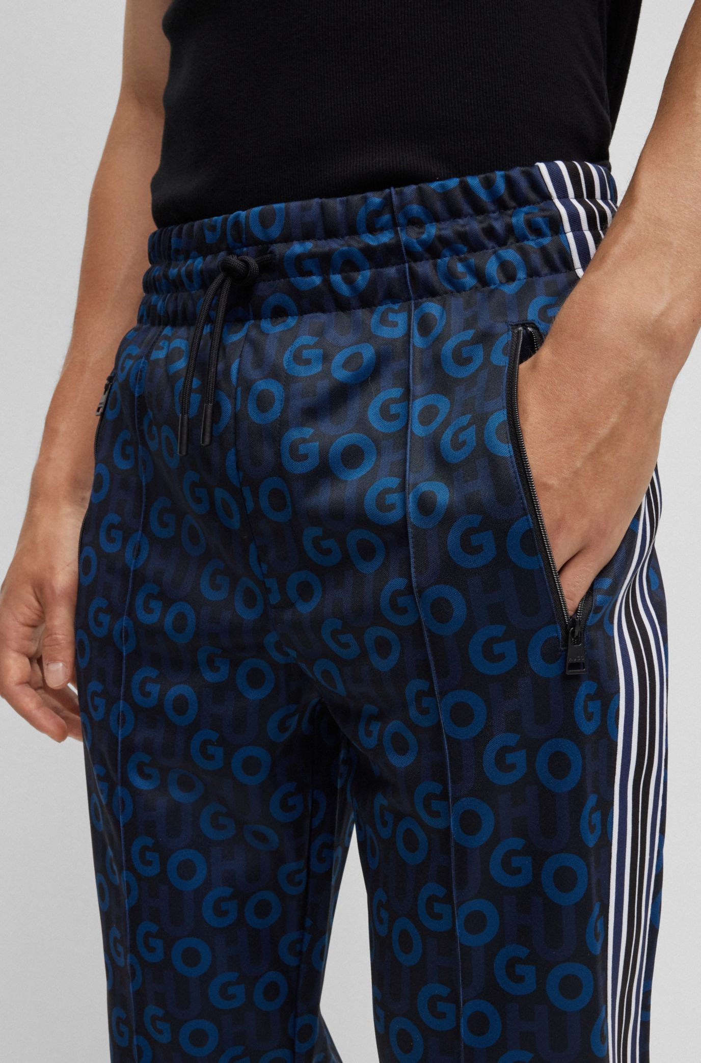 Hugo Boss Monogram-print Side-stripe Track Pants In Black