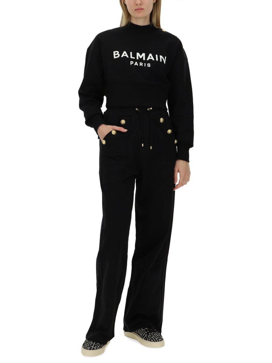 Shop Balmain Loose-fitting Buttoned Joggers In Black