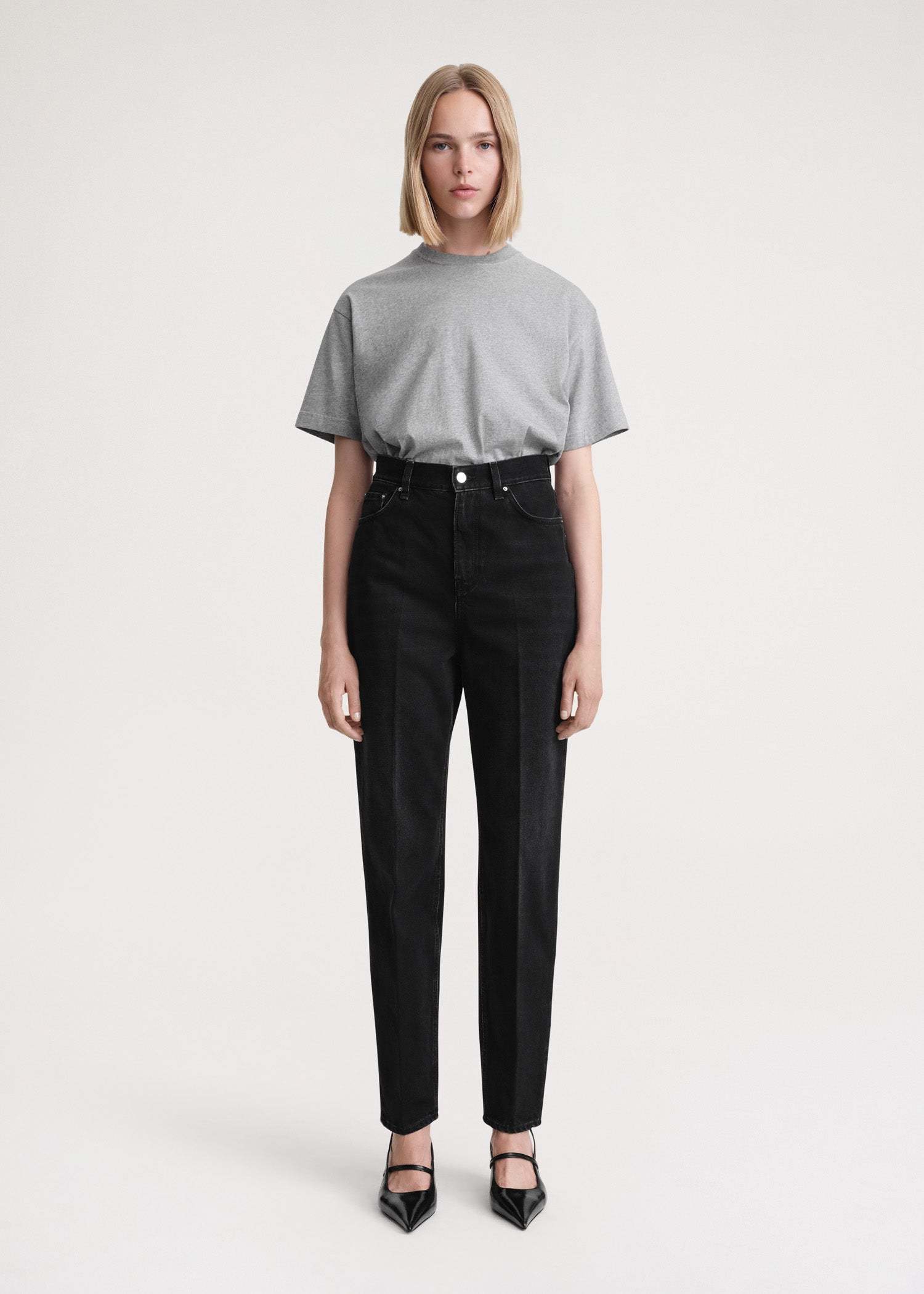 Totême Faded-effect Tapered-leg Jeans In Black