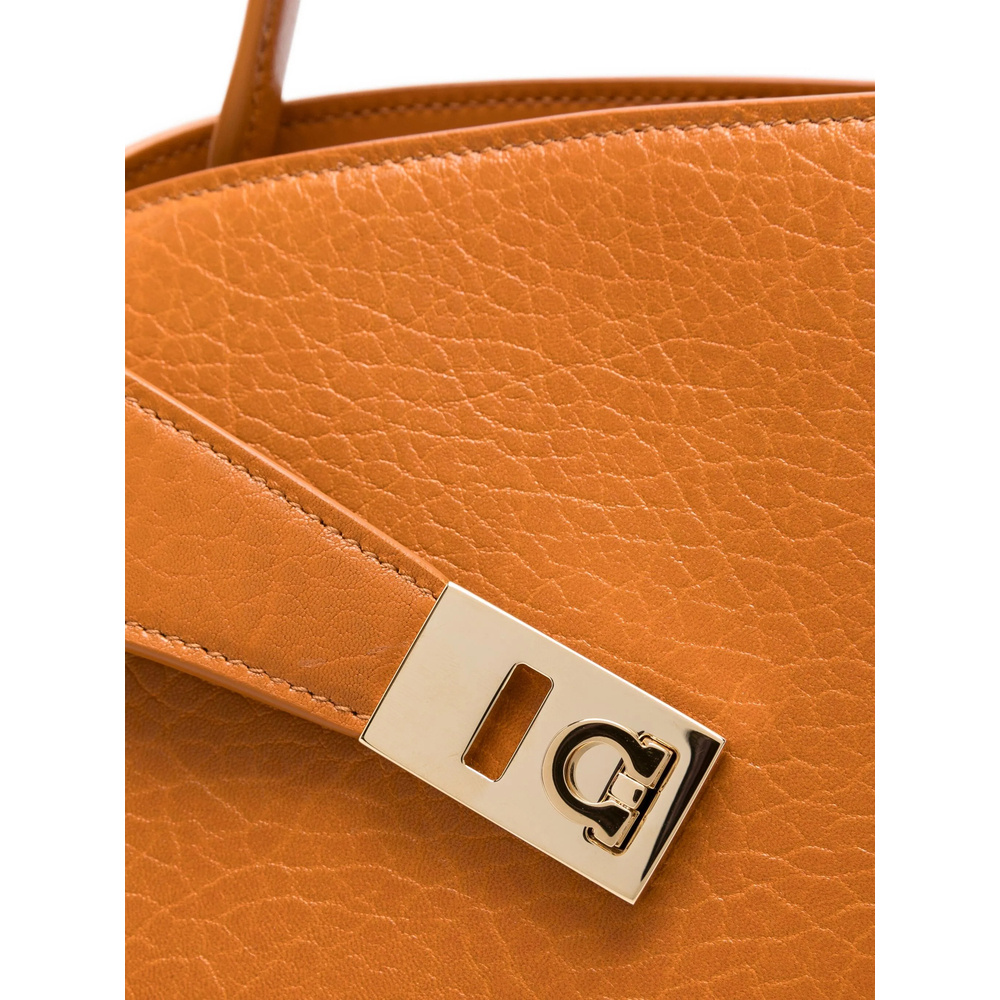 Ferragamo Small Hug Grained Leather Top Handle Bag In Orange