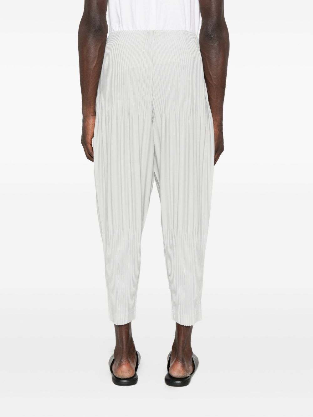 Issey Miyake Basic Pleated Tapered-leg Knitted Trousers In Gray