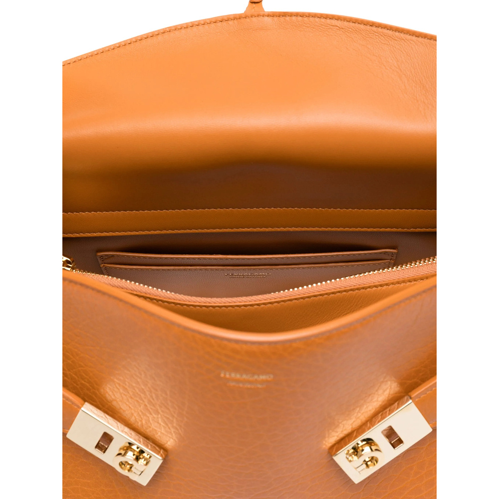Ferragamo Small Hug Grained Leather Top Handle Bag In Orange