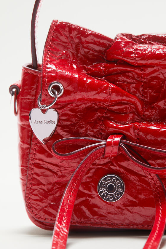 Acne Studios Multipocket Crinkle Patent Leather Top Handle Bag In Red