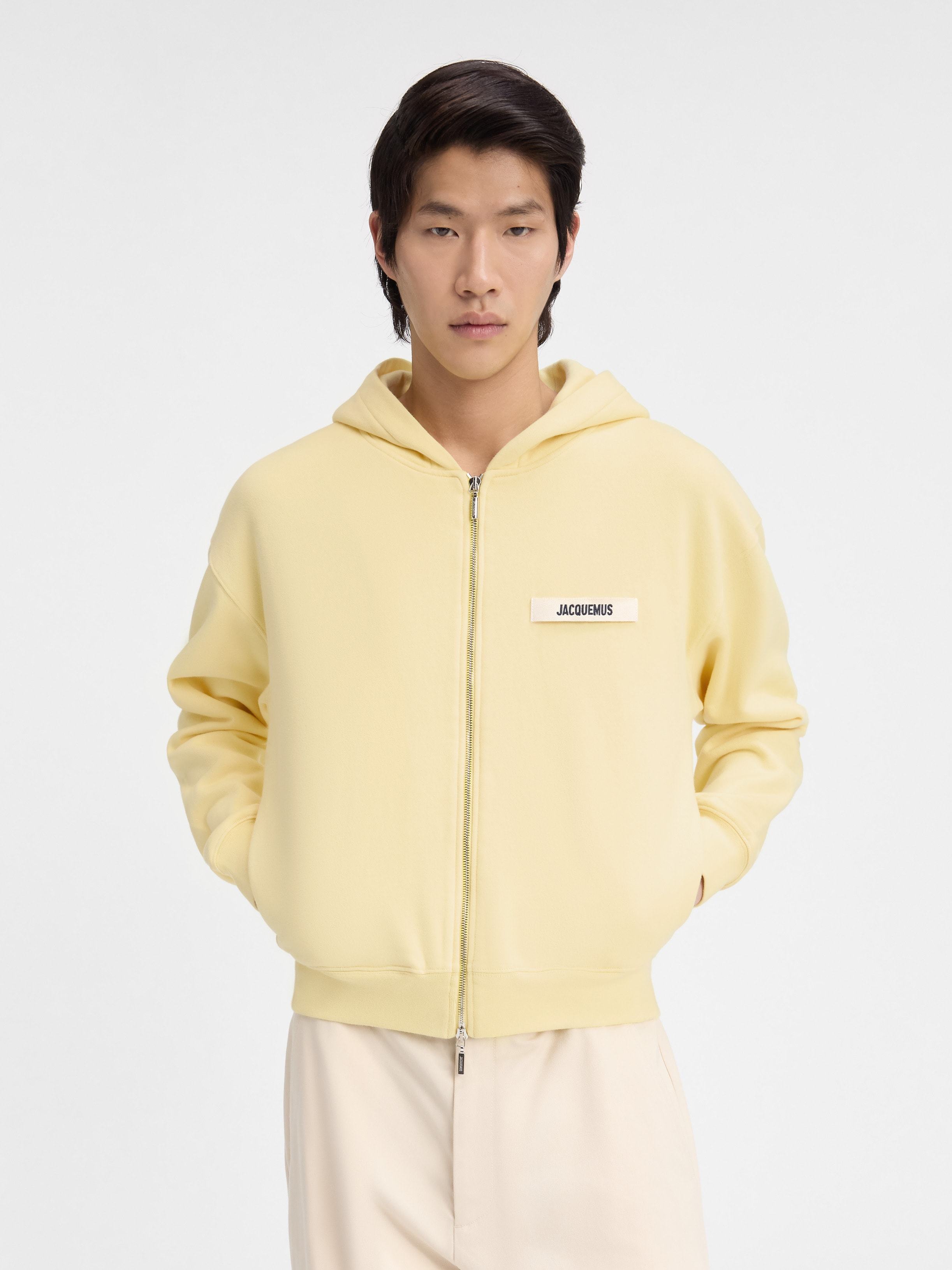 Shop Jacquemus Grosgrain Logo Zip Hoodie In Nude