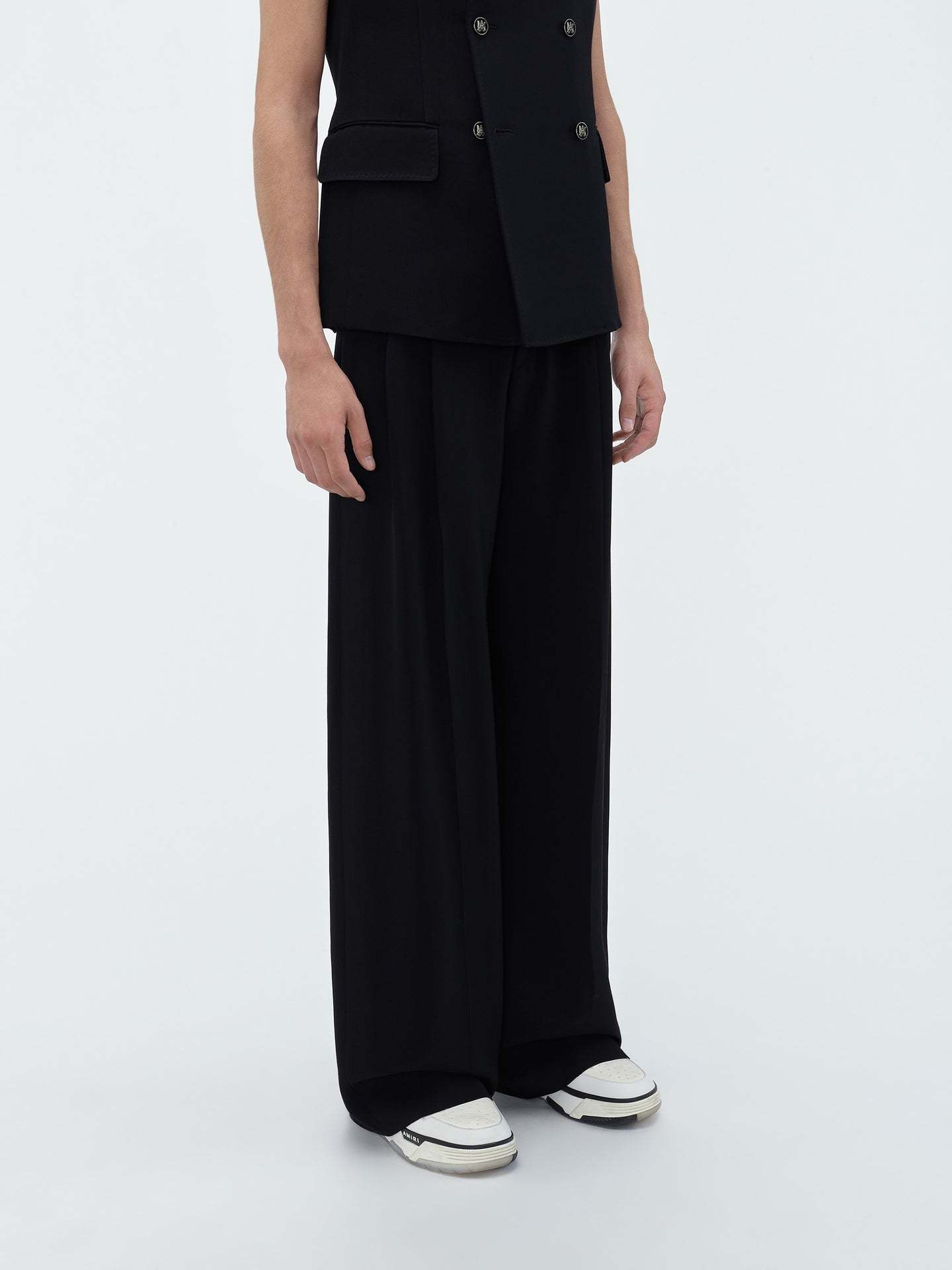 AMIRI AMIRI LOGO PATCH TAPERED LEG TROUSERS