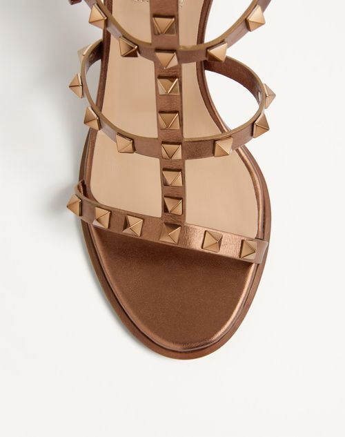 Shop Valentino Rockstud Metallic Calfskin Leather Ankle Strap Sandal 90 Mm In Bronze