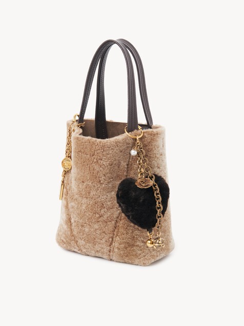 Chloé Symbols Heart Shearling Bag Charm In Brass In Black