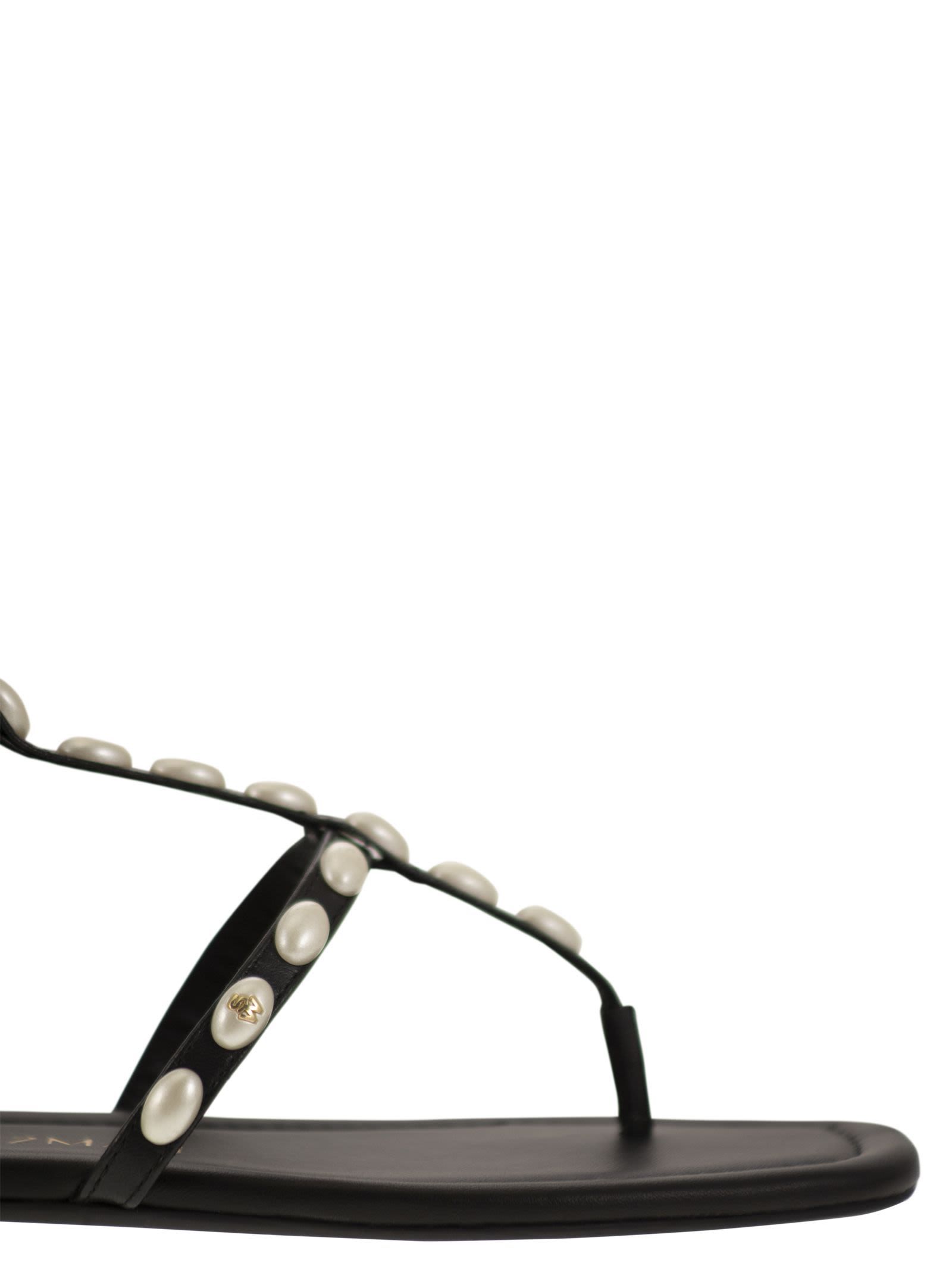 Shop Stuart Weitzman Embellished Pearlita Thong Sandals In Black