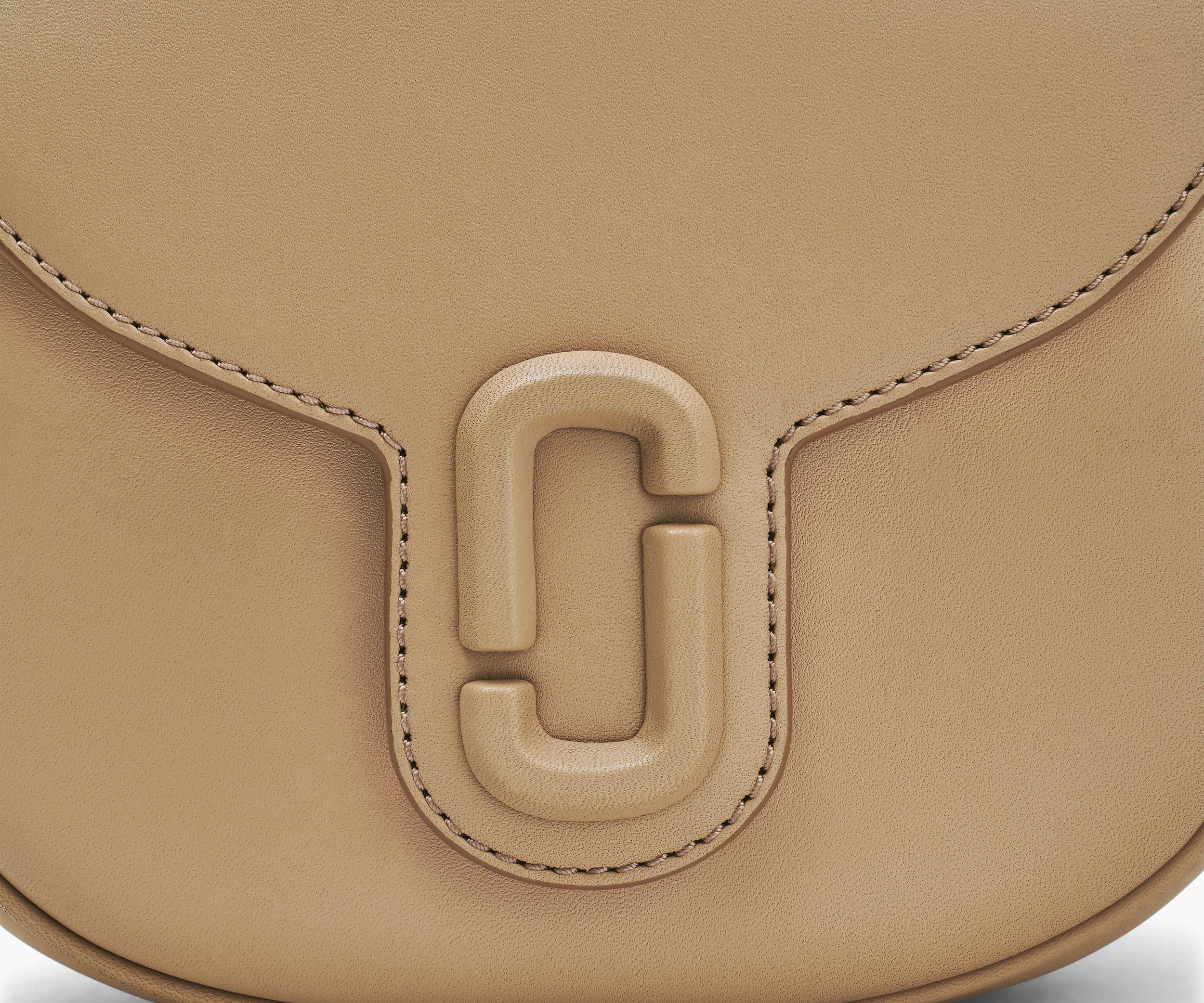 Shop Marc Jacobs The Covered J Marc Saddle Bag In Nude